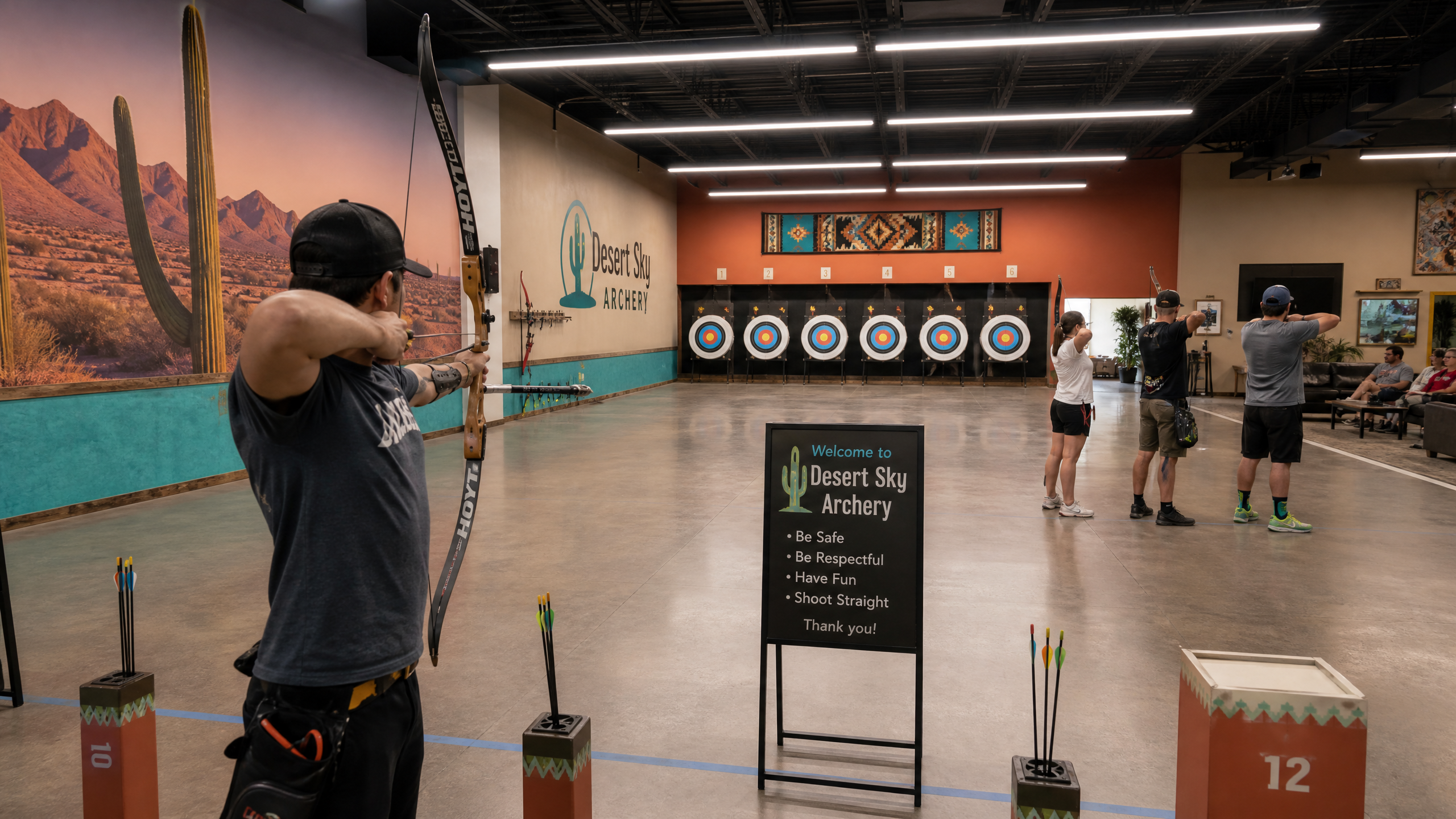 Modern air-conditioned indoor archery range with Southwest design and a recurve bow